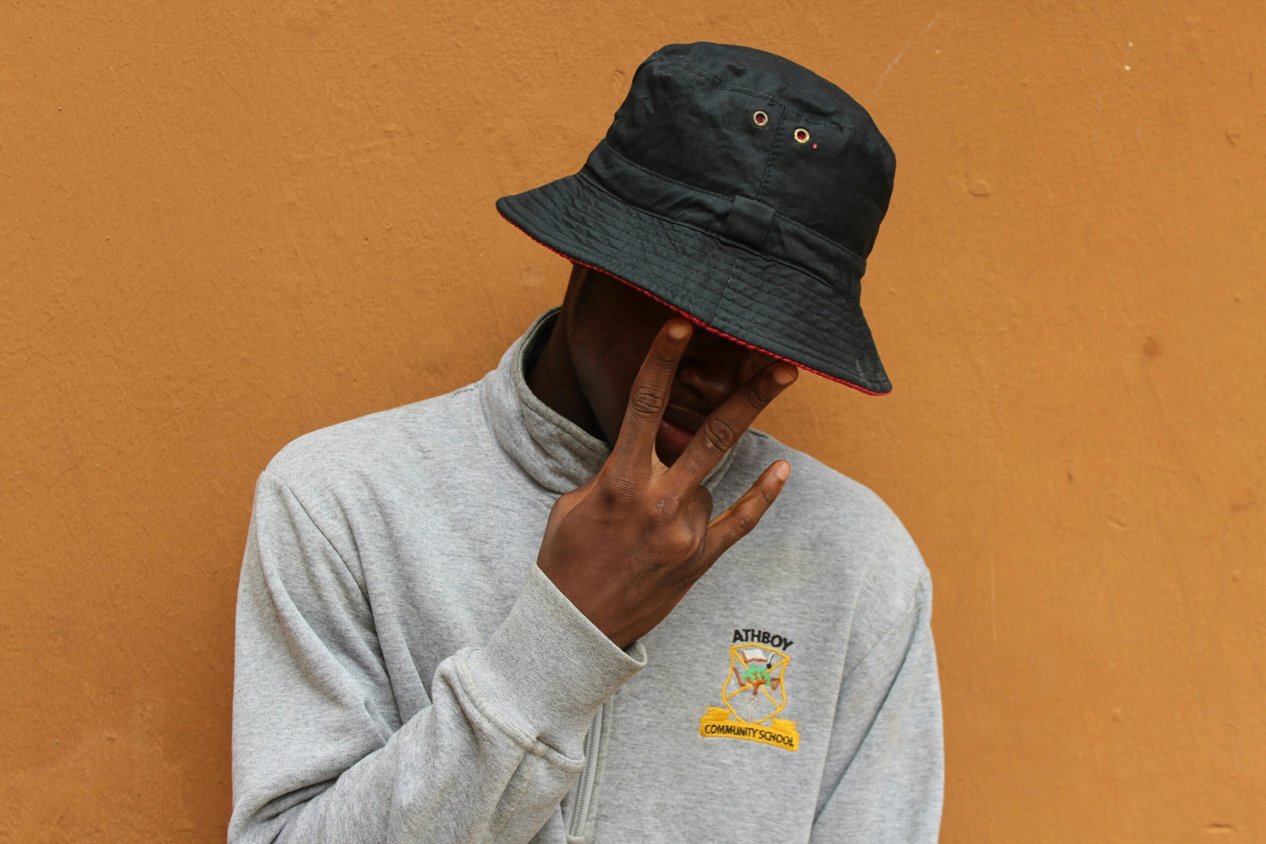 Always Covered Behind His Hat